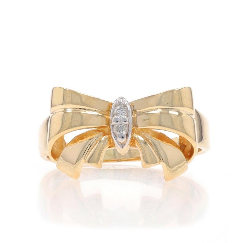 Size: 3 1/2
Sizing Fee: Up 3 sizes for $40 or Down 1 size for $30

Era: Vintage

Metal Content: 10k Yellow Gold & 10k White Gold

Stone Information

Natural Diamonds
Carat(s): .02ctw
Cut: Round Brilliant
Color: H - I
Clarity: I1

Style: