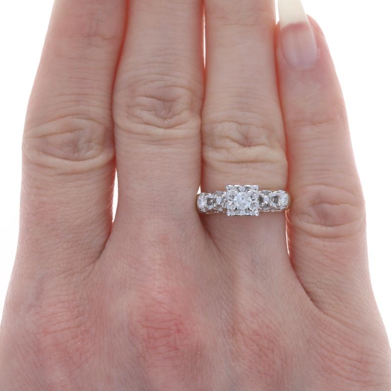 Size: 8 1/2
Sizing Fee: Up 2 sizes for $70 or Down 2 sizes for $60

Era: Vintage

Metal Content: 14k Yellow Gold & 14k White Gold

Stone Information
Natural Diamonds
Carat(s): .50ctw
Cut: Round Brilliant
Color: G - H
Clarity: SI2 - I1

Total Carats: