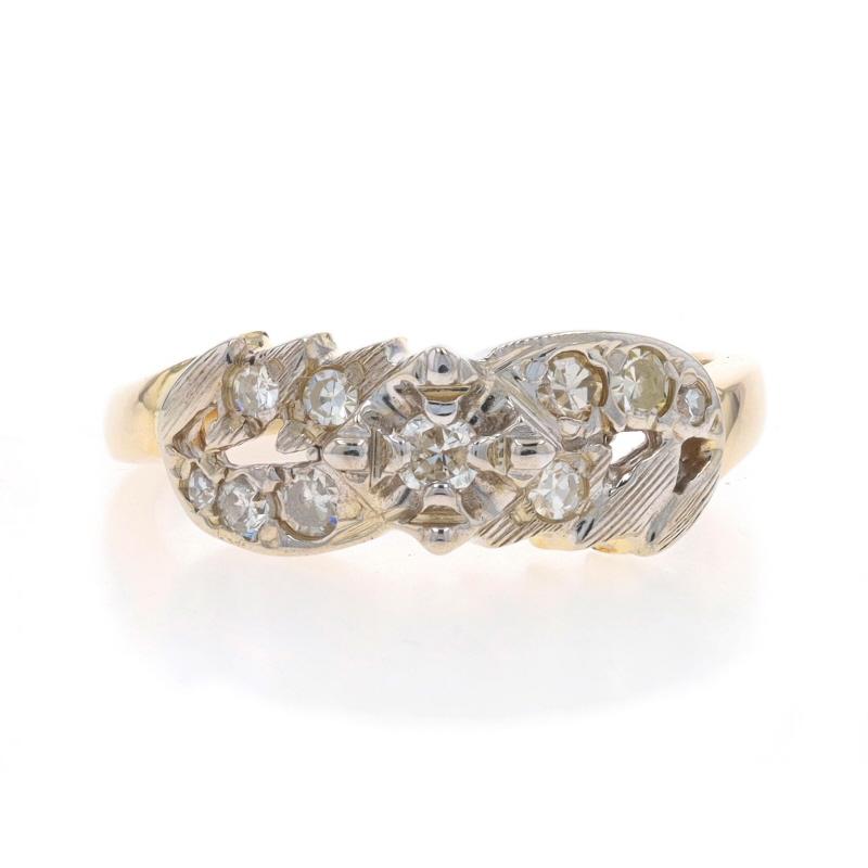 Size: 6 1/2
Sizing Fee: Up 2 1/2 sizes for $35 or Down 1 size for $35

Era: Vintage

Metal Content: 14k Yellow Gold & 14k White Gold

Stone Information

Natural Diamonds
Carat(s): .28ctw
Cut: Round Brilliant (center) & Single
Color: J - K
Clarity:
