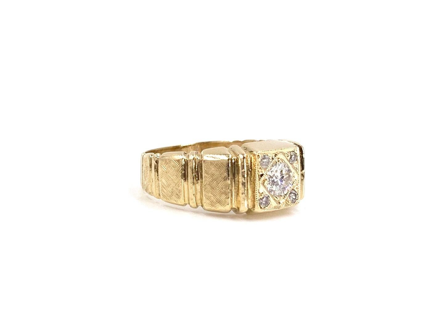 A wearable 14 karat yellow gold flush set diamond ring featuring five round brilliant diamonds at approximately .37 carats total weight. Ring is adorned with a hand etched finish and vertical polished bars for added character. Center diamond quality