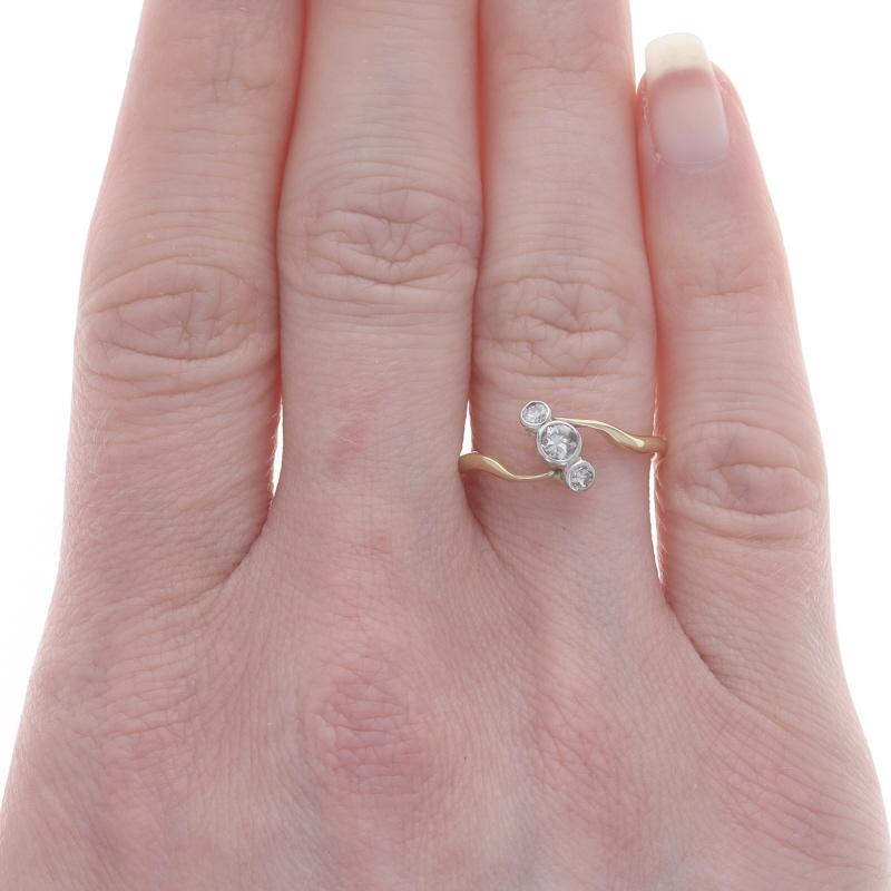 Old European Cut Yellow Gold Diamond Vintage Three-Stone Bypass Ring 14k European.22ctw Bezel Set For Sale