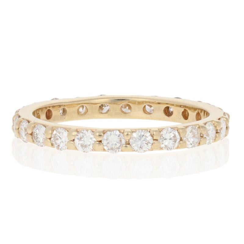 This ring is a size 5 3/4 - 6.

Metal Content: Guaranteed 14k Gold as stamped

Stone Information: 
Natural Diamonds  
Clarity: SI1 - SI2 
Color: G - H   
Cut: Round Brilliant 
Total Carats: 0.95ctw

Style: Eternity Wedding Band With Diamonds 
Face