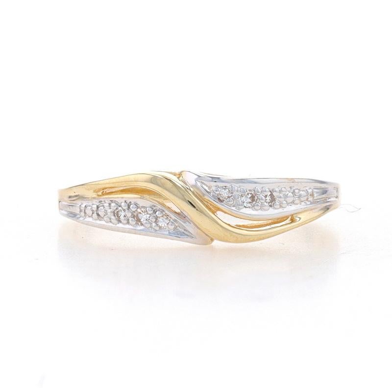 Size: 7
Sizing Fee: Up 2 sizes for $35 or Down 2 sizes for $30

Metal Content: 14k Yellow Gold & 14k White Gold

Stone Information
Natural Diamonds
Carat(s): .04ctw
Cut: Single
Color: I - J
Clarity: VS2 - SI1

Style: Crossover Bypass Wedding Band