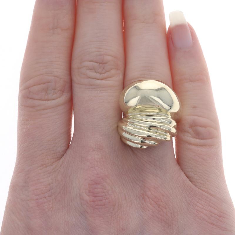 Size: 7 1/4
Sizing Fee: Up 1 size for $35 or Down 1/2 a size for $35

Metal Content: 14k Yellow Gold

Style: Dome Statement Bypass
Features: Smoothly Finished with Ribbed Detailing

Measurements
Face Height (north to south): 29/32