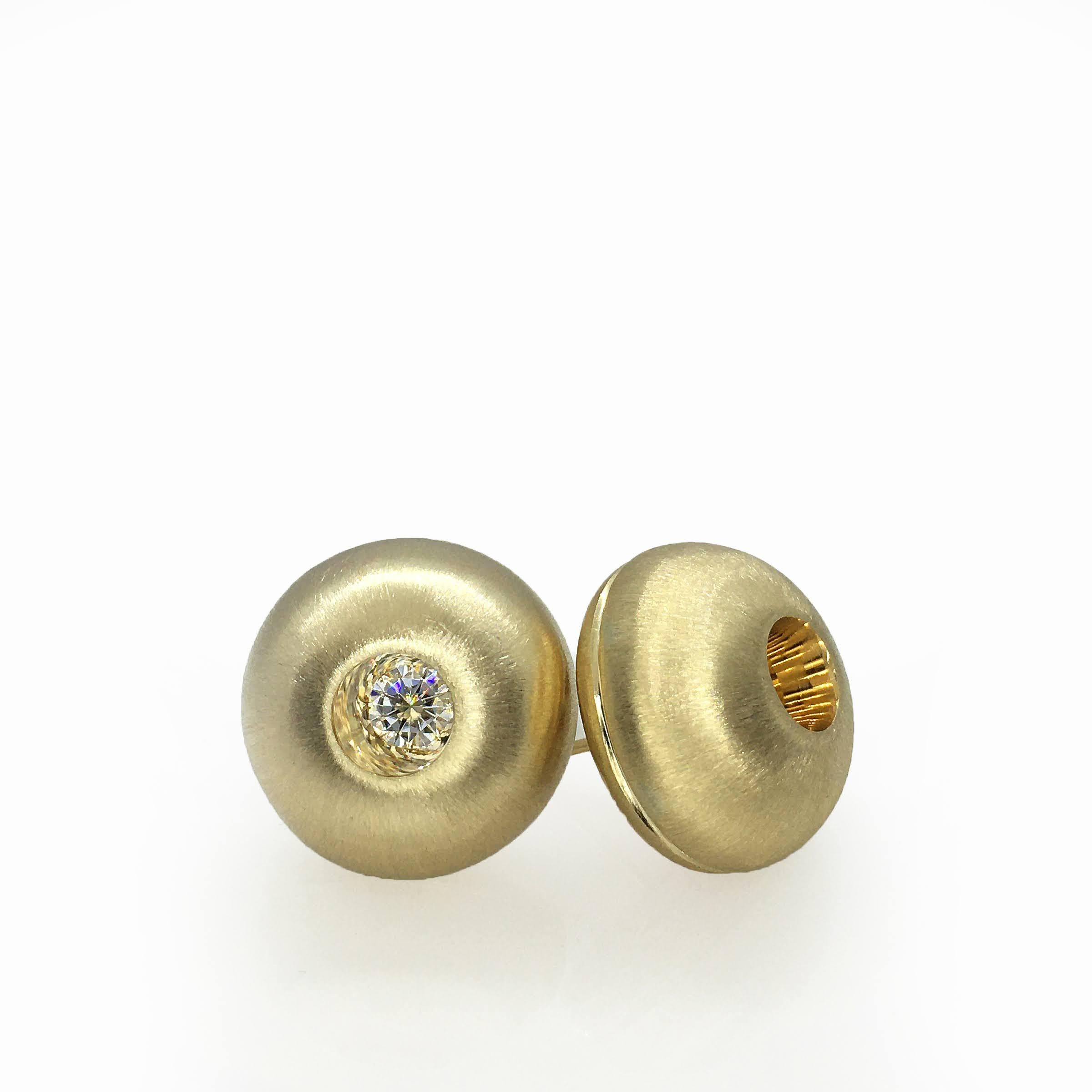 These White Sapphire in Yellow Gold Dome Stud Earrings, part of our Power Series, are a symbolic design inspired by the idea of looking inward, the notion of what a person needs is already inside of them. The clean and classic lines are imaginative,