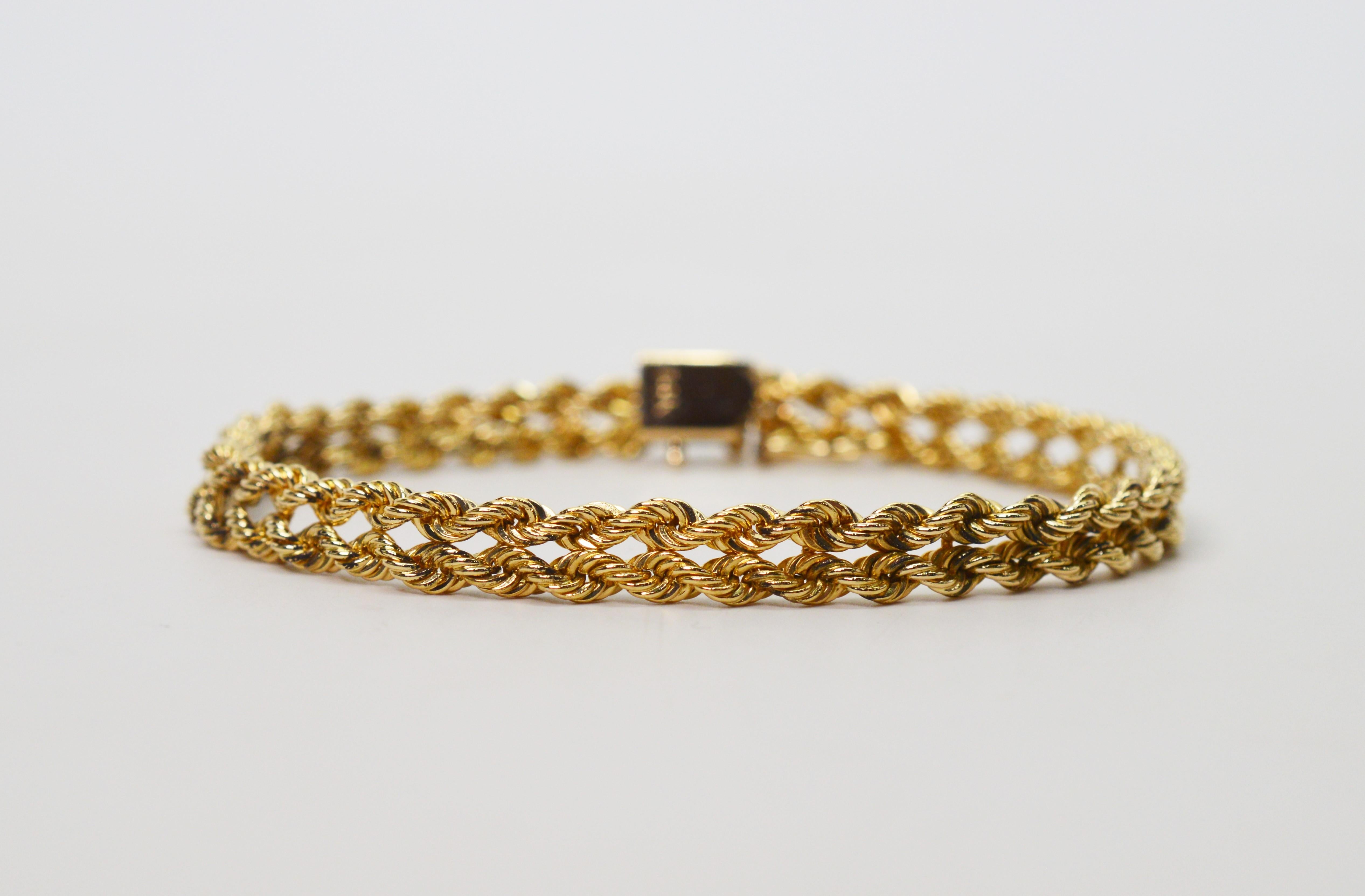 Seven inches of double fourteen carat yellow gold make this bright and versatile bracelet outfitted with a box closure and safety catch. The width of the bracelet is approximately one quarter inch making is perfect to stack or wear alone. In gift