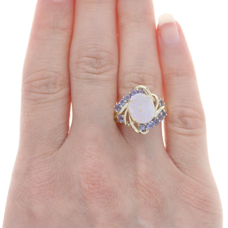 Size: 7 1/4
Sizing Fee: Down 1 size or up 2 sizes for $35

Metal Content: 10k Yellow Gold

Stone Information

Natural Druzy Quartz
Cut: Oval

Natural Tanzanites
Treatment: Routinely Enhanced
Carat(s): .96ctw
Cut: Round
Color: Purple

Total Carats: