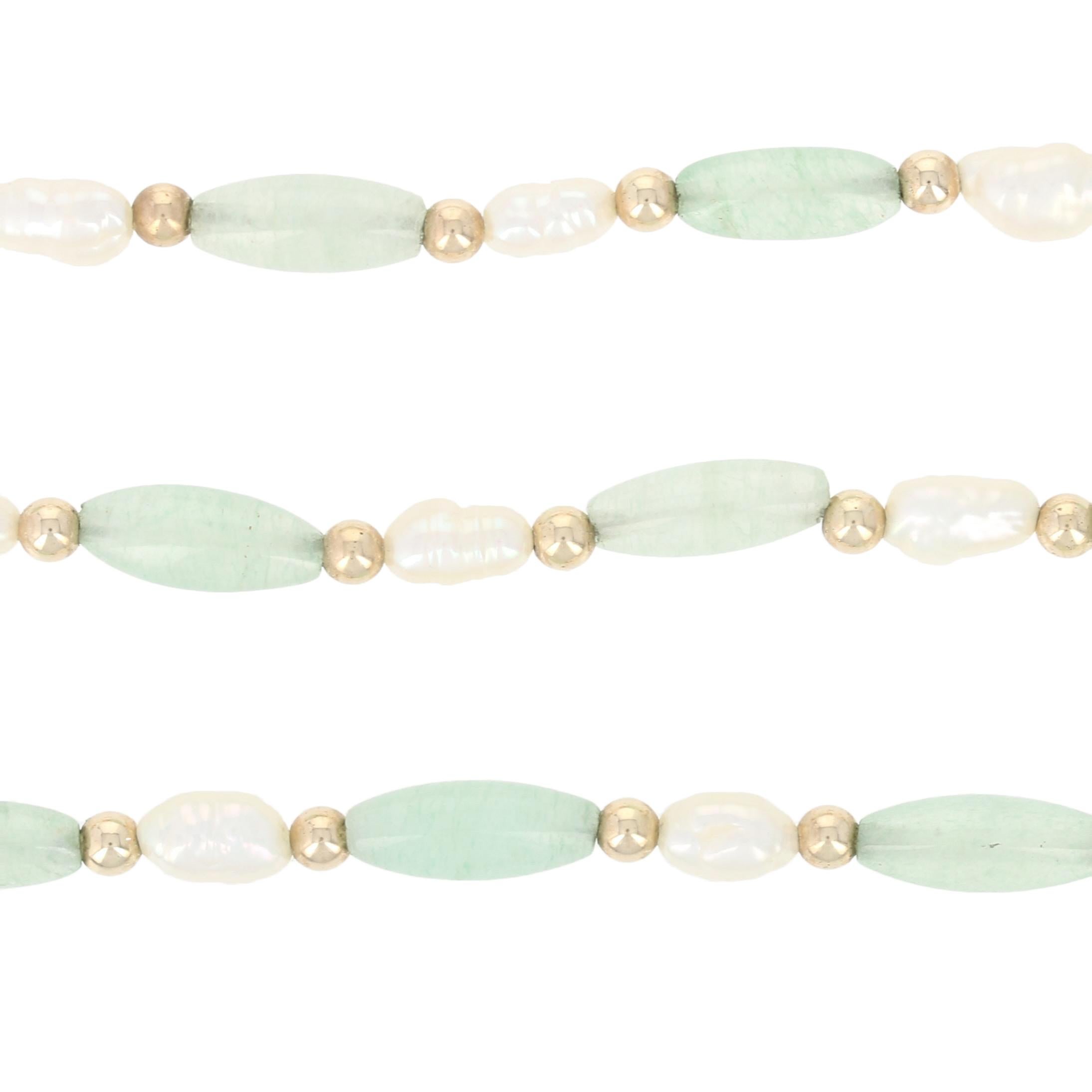 green and white pearl necklace