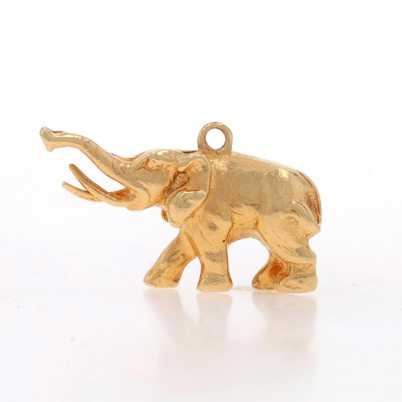 Metal Content: 14k Yellow Gold

Theme: Elephant, Walking Pachyderm

Measurements

Tall (from stationary bail): 1/2