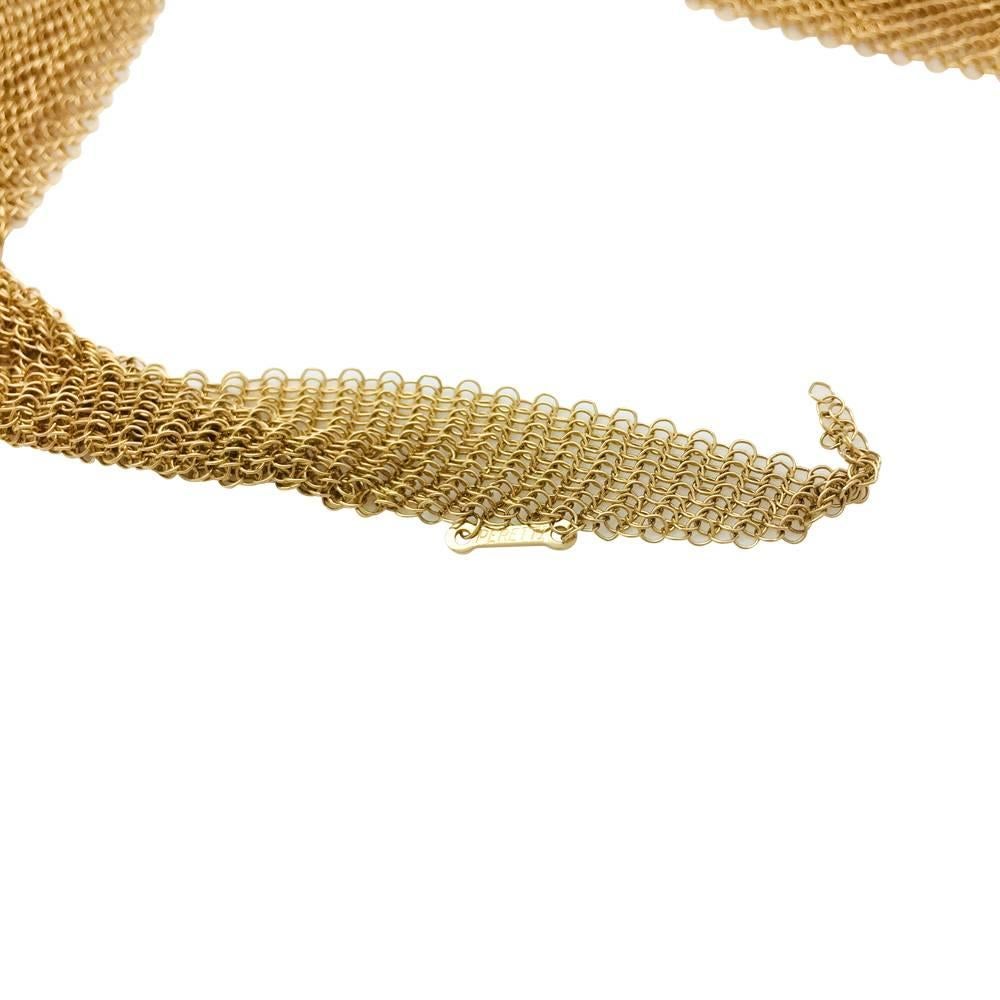 A 750/000 yellow gold Elsa Peretti necklace for Tiffany & Co. 
The links are as supple as tissue, it can be worn as a scarf. 
Length: 106,7 cm
Width 52 mm
Weight 87,6 grams
Retail price: €29.500.00
