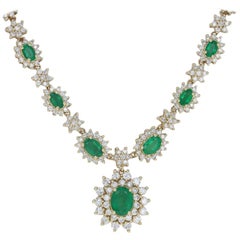 Yellow Gold Emerald and Diamond Halo Necklace, 14 Karat Oval Cut 6.10 Carat