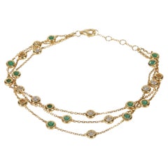 Pulsera de oro amarillo con esmeralda y diamantes de tres vueltas