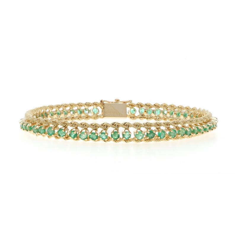 Metal Content: 14k Yellow Gold

Stone Information

Natural Emeralds
Treatment: Oiling
Carat(s): 3.78ctw
Cut: Round

Total Carats: 3.78ctw

Chain Style: Diamond Cut Rope
Bracelet Style: Chain
Fastening Type: Tab Box Clasp with Side Safety