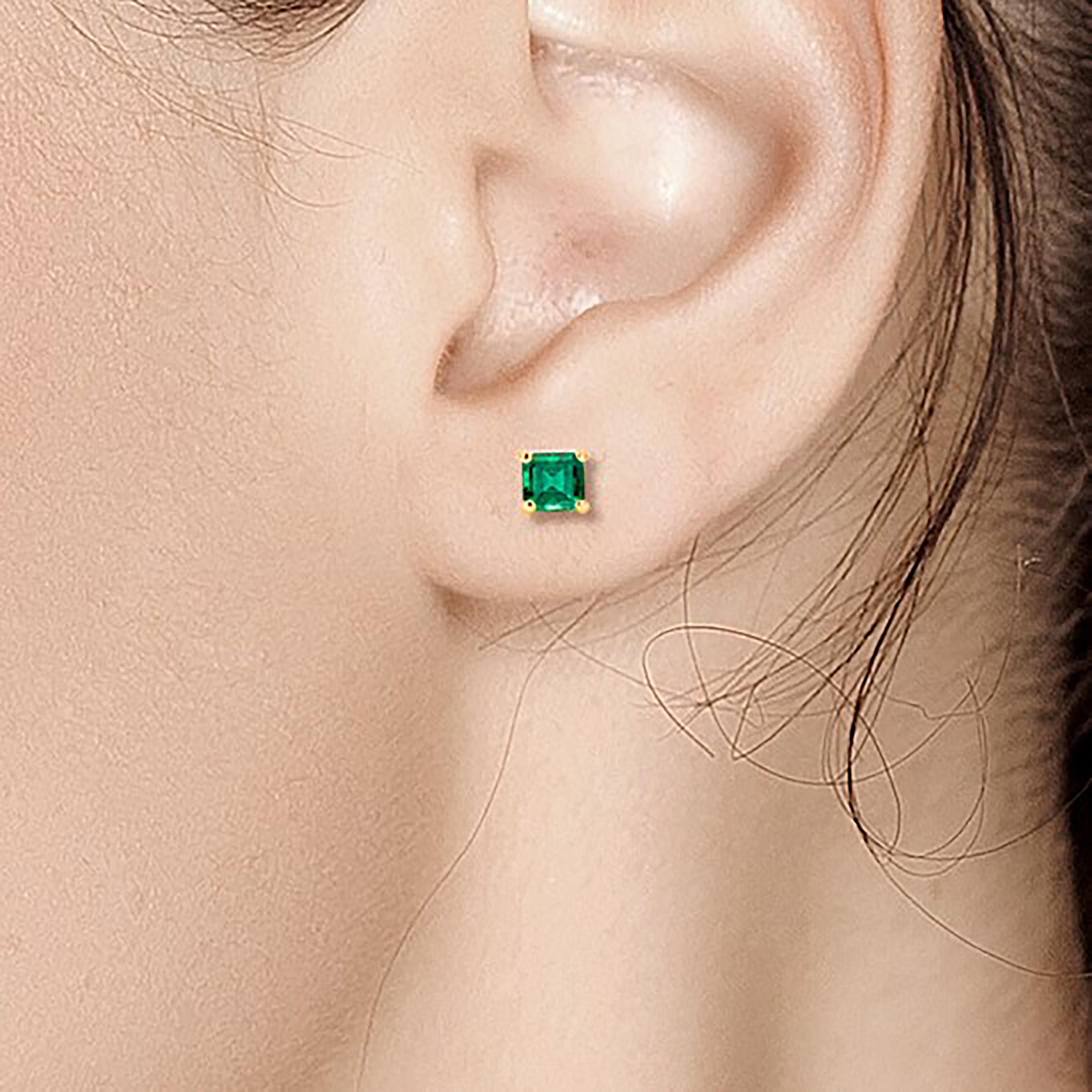 Contemporary Yellow Gold Emerald Cut Columbian Emerald Stud Earrings