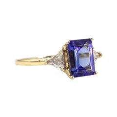 Yellow Gold Emerald Cut Tanzanite and Diamond Three-Stone Ring