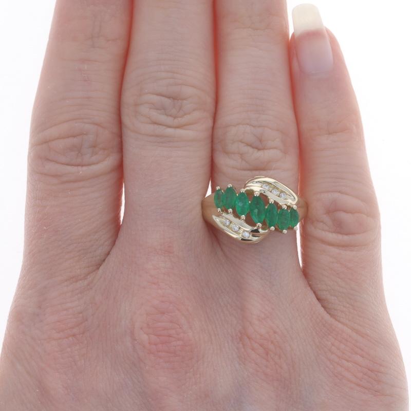 Size: 7 1/4
Sizing Fee: Up 2 sizes for $35 or Down 2 sizes for $30

Metal Content: 14k Yellow Gold

Stone Information

Natural Emeralds
Treatment: Oiling
Carat(s): .73ctw
Cut: Marquise
Color: Green

Natural Diamonds
Carat(s): .05ctw
Cut: Round
