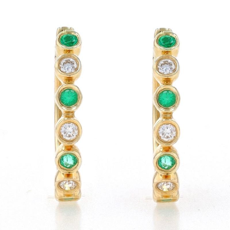 Metal Content: 14k Yellow Gold

Stone Information
Natural Emeralds
Treatment: Oiling
Carat(s): .16ctw
Cut: Round
Color: Green

Natural Diamonds
Carat(s): .10ctw
Cut: Round Brilliant
Color: G
Clarity: VS2 - SI1

Total Carats: .26ctw

Style: