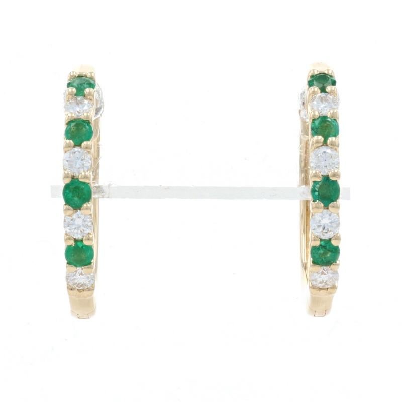 Metal Content: 14k Yellow Gold 

Stone Information: 
Natural Emeralds
Treatment: Oiling
Carats: .20ctw 
Cut: Round 
Color: Green

Natural Diamonds
Carats: .20ctw
Cut: Round Brilliant  
Color: G 
Clarity: VS2 - SI1 

Total Carats: .40ctw 

Style: