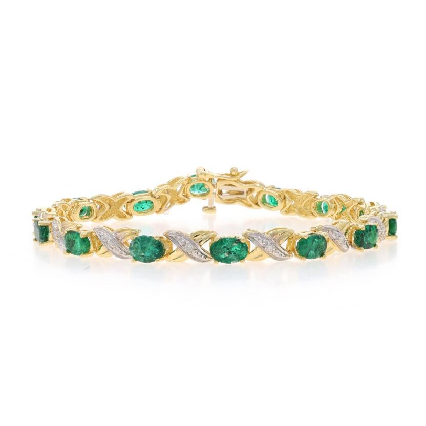 Metal Content: 14k Yellow Gold & 14k White Gold

Stone Information

Natural Emeralds
Treatment: Oiling
Carat(s): 7.28ctw
Cut: Oval
Color: Green

Natural Diamonds
Carat(s): .15ctw
Cut: Round Brilliant
Color: H - I
Clarity: I1 - I2

Total Carats: