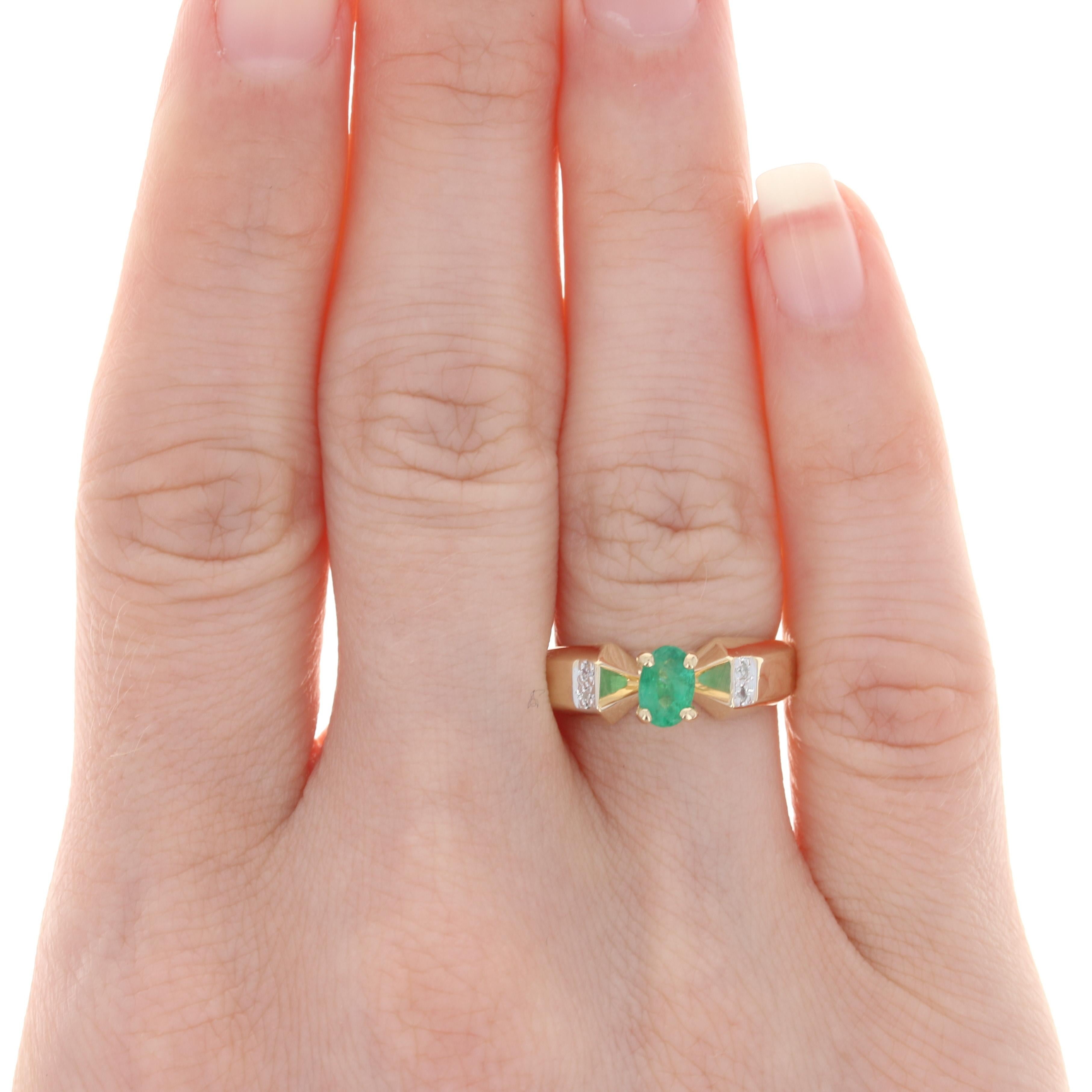 Size: 6
Sizing Fee: Down 2 sizes for a $20 fee or up 2 sizes for a $25 fee

Metal Content: 14k Yellow Gold & 14k White Gold

Stone Information: 
Genuine Emerald
Treatment: Oiling
Carat: .50ct
Cut: Oval
Color: Green
Size: 5.9mm x 4mm

Natural