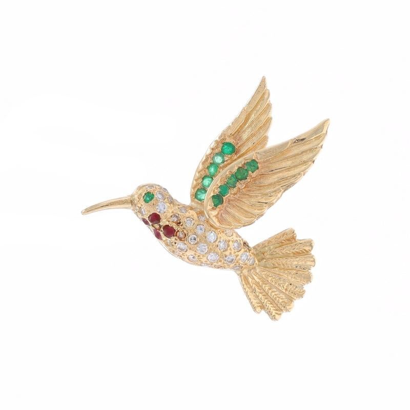Metal Content: 14k Yellow Gold

Stone Information

Natural Emeralds
Treatment: Oiling
Carat(s): .22ctw
Cut: Round
Color: Green

Nautral Rubies
Treatment: Heating
Carat(s): .12ctw
Cut: Round
Color: Red

Natural Diamonds
Carat(s): .17ctw
Cut: