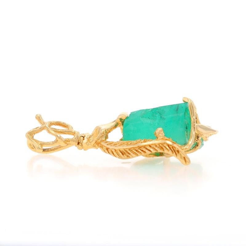 Metal Content: 18k Yellow Gold

Stone Information

Natural Emerald
Treatment: Oiling
Carat(s): ~20.00ct
Cut: Rough
Color: Green

Total Carats: ~20.00ct

Style: Solitaire
Theme: Botanical Leaf

Measurements

Tall (from extended bail): 1 29/32