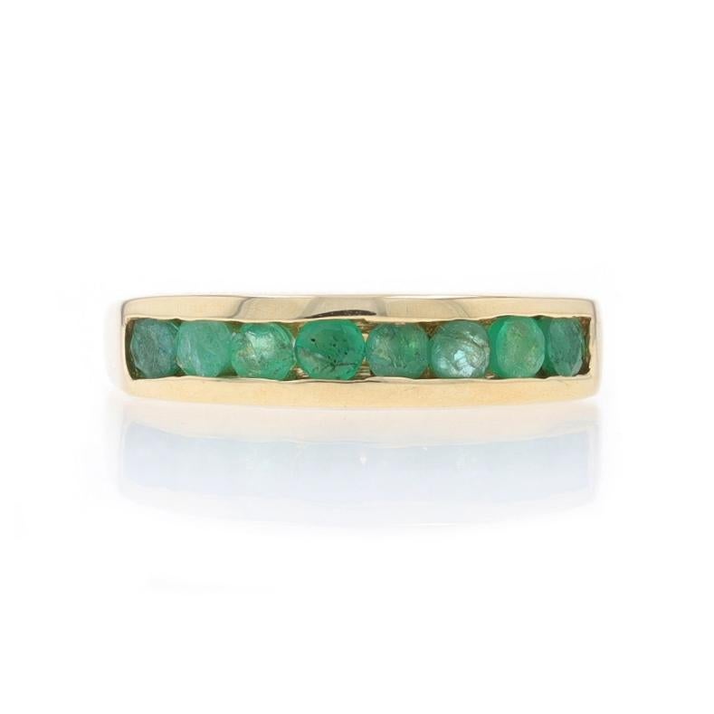 Size: 6 1/4

Metal Content: 10k Yellow Gold

Stone Information

Natural Emeralds
Treatment: Oiling
Carat(s): .56ctw
Cut: Round
Color: Green

Total Carats: .56ctw

Style: Band
Features: Channel Set Stones

Measurements

Face Height (north to south):