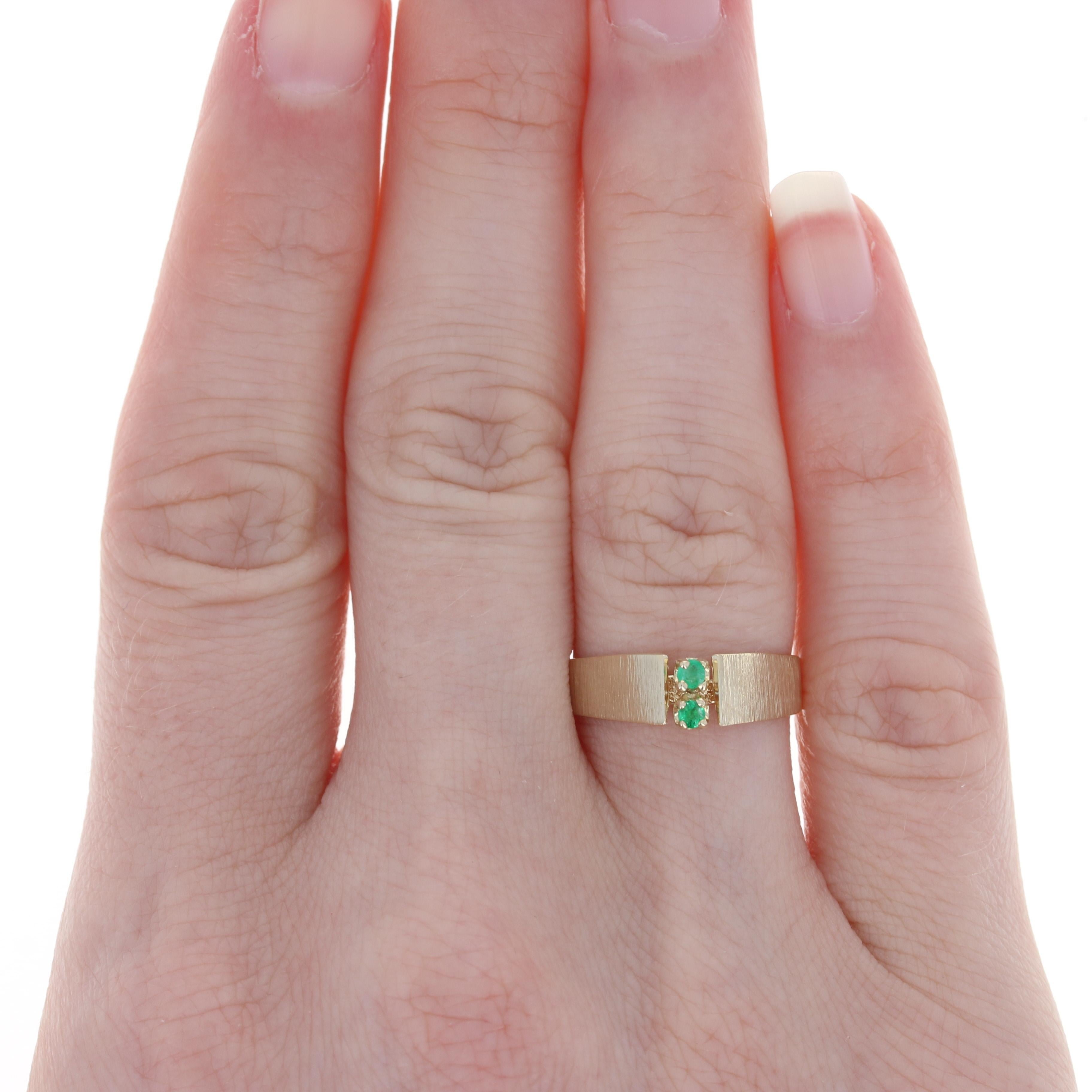 Size: 6 1/4
 Sizing Fee: Up 2 sizes for $30 or Down 2 sizes for $25
 
 Metal Content: 14k Yellow Gold
 
 Stone Information: 
 Genuine Emeralds
 Treatment: Oiling
 Total Carats: .08ctw
 Cut: Round
 Color: Green 
 
 Style: Two-Stone 
 Features: