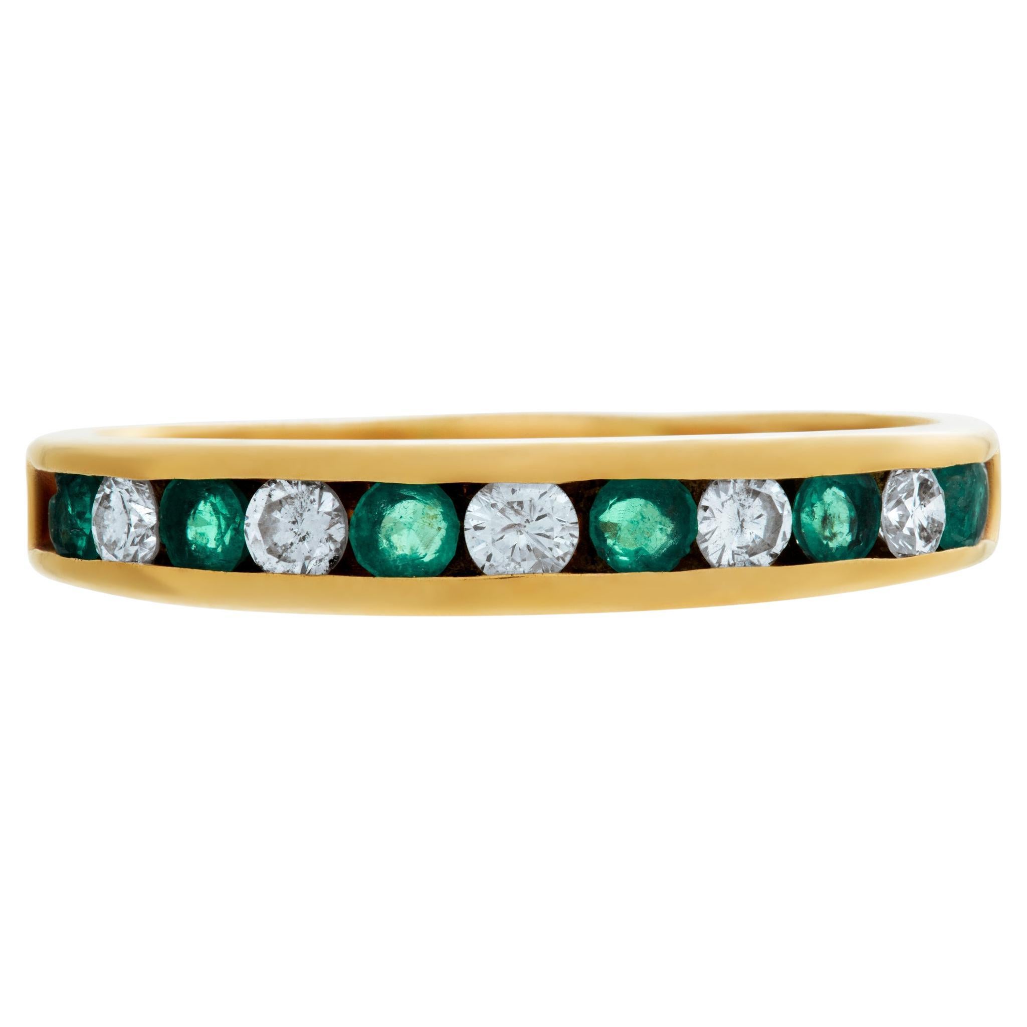 Yellow gold emeralds and diamonds semi eternity band ring For Sale