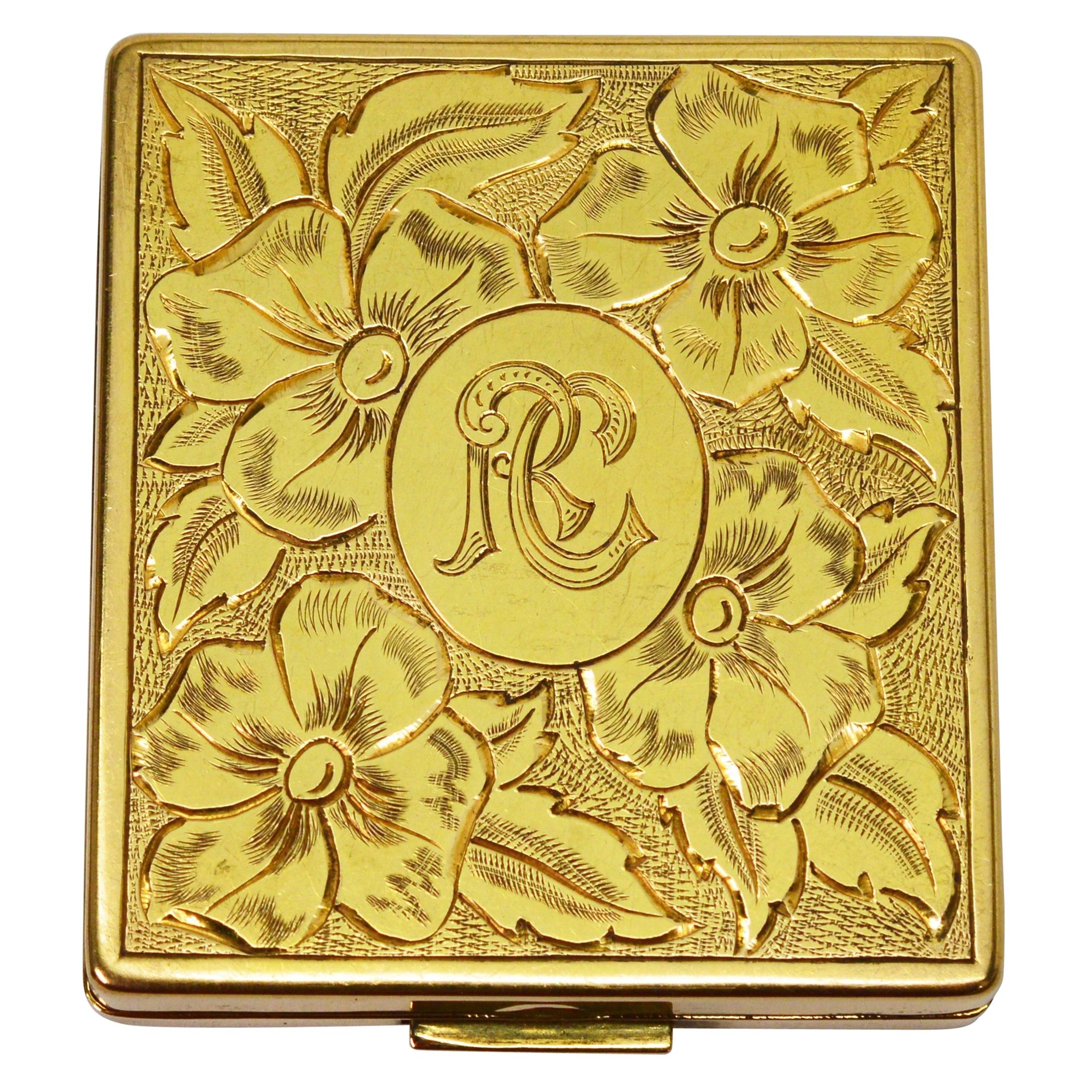 Compacto de oro amarillo grabado con espejo, hacia 1950
