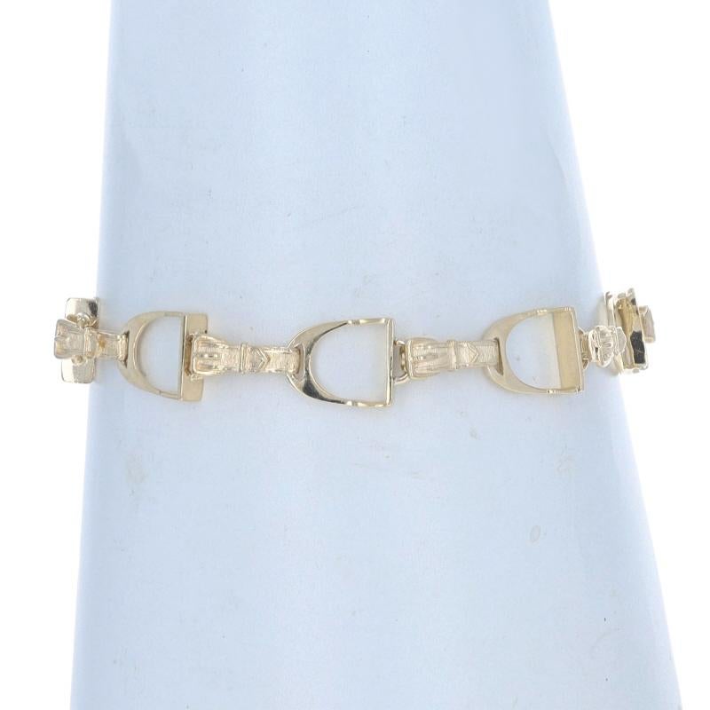 Metal Content: 14k Yellow Gold

Style: Link
Fastening Type: Lobster Claw Clasp with Safety Chain
Theme: Equestrian Stirrup, Horses
Features: Smoothly Finished with Etched Detailing

Measurements
Length: 7 1/4
