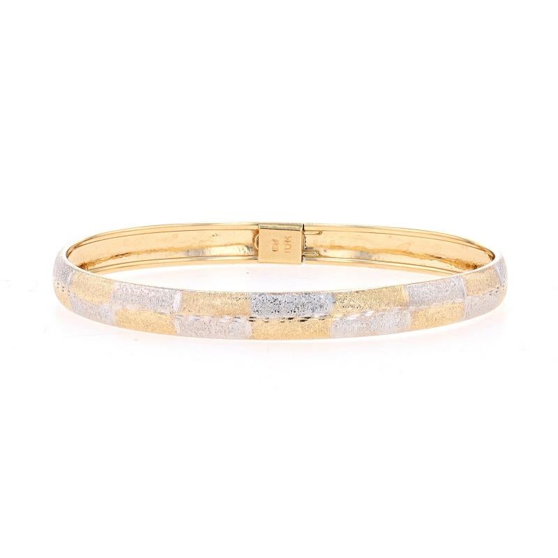 Metal Content: 10k Yellow Gold & 10k White Gold

Style: Bangle
Fastening Type: Slide Clasp with OneSafety Clasp
Theme: Checkerboard
Features: Etched & Stardust-Textured Detailing

Measurements

Inner Circumference: 7