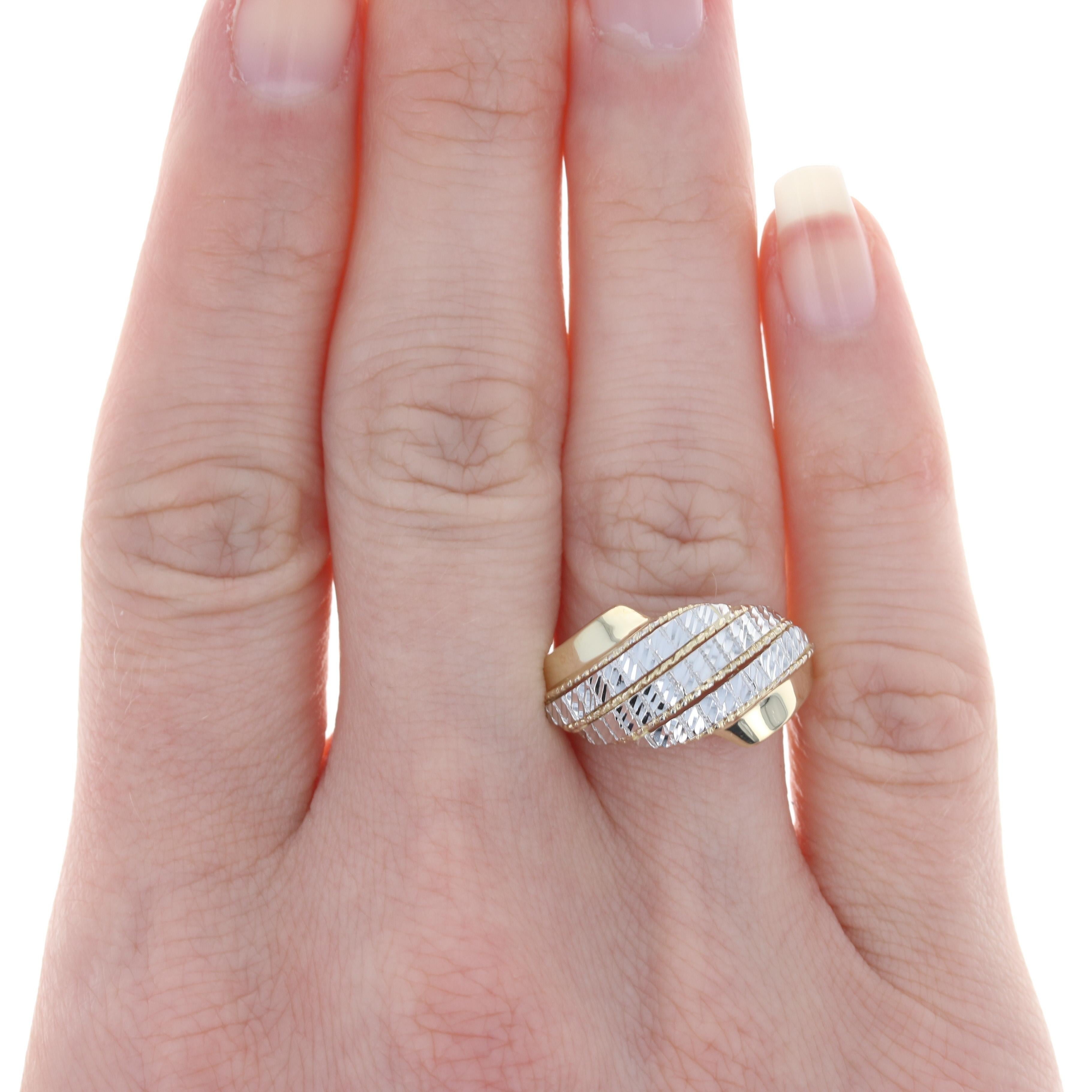 Size: 8
 Sizing Fee: Down 3 sizes for $20 or Up 2 sizes for $25
 
 Metal Content: 14k Yellow Gold & 14k White Gold
 
 Style: Statement Bypass
 Features: Smooth & Textured Finishes
 
 Face Height (north to south): 7/16
