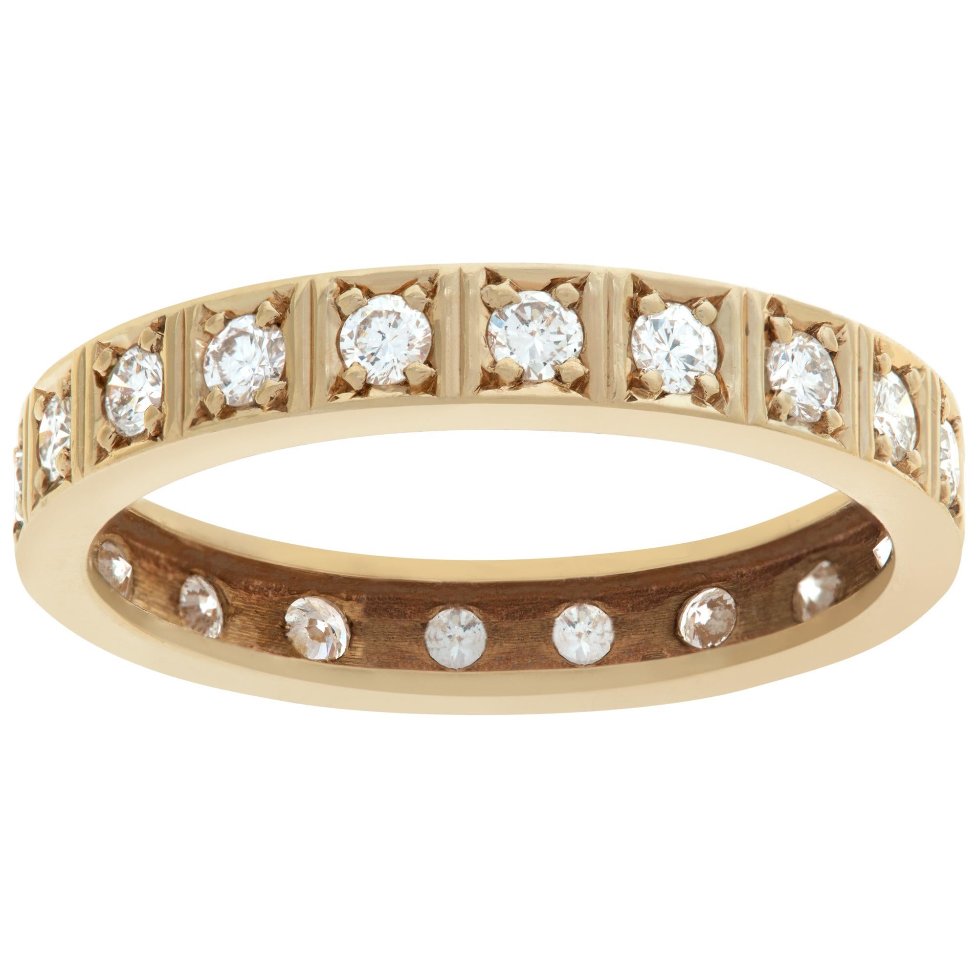Yellow gold eternity band with diamonds