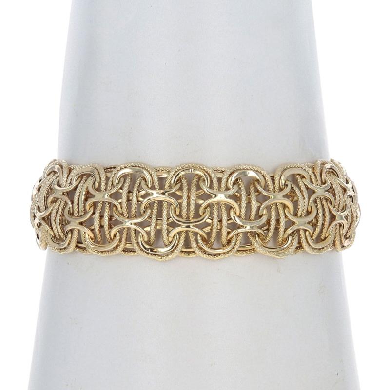 Metal Content: 14k Yellow Gold

Chain Style: Fancy Link
Bracelet Style: Chain
Fastening Type: Spring Ring Clasp
Features: Hollow Construction with Textured Detailing

Measurements

Length: 7 1/2