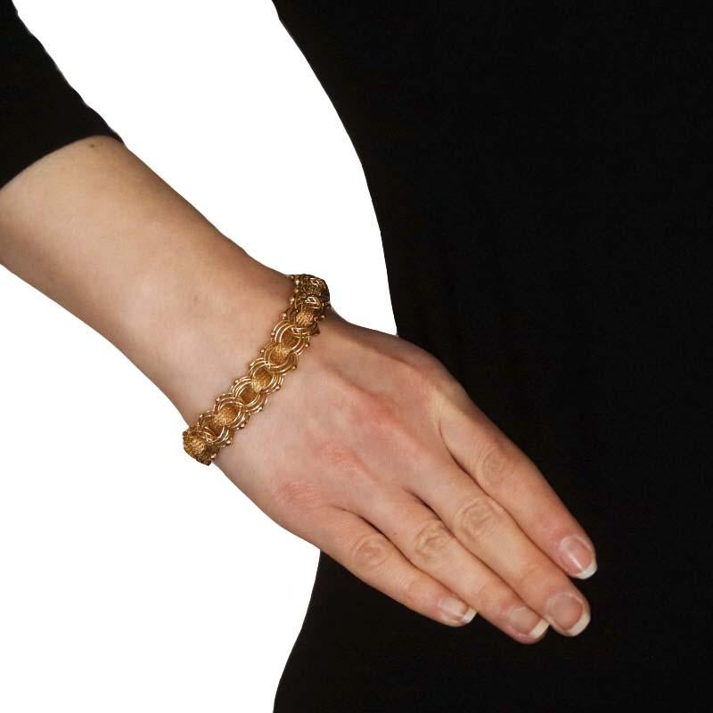 Metal Content: 14k Yellow Gold

Chain Style: Fancy Triple Curb
Bracelet Style: Chain
Fastening Type: Tab Box Clasp with One Side Safety Clasp

Measurements

Length: 7 3/4