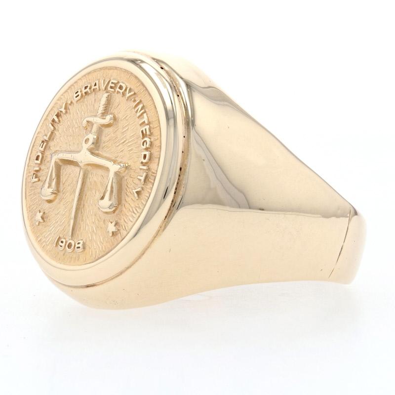 Crafted in 10k yellow gold, this handsome signet ring recognizes 10 years of service in the Federal Bureau of Investigation. The ring's round face showcases a sword and scales framed by the FBI motto 