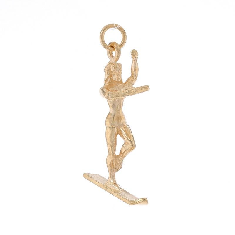 Metal Content: 14k Yellow Gold

Theme: Female Water Skier, Aquatic Sport, Summer Recreation

Measurements

Tall (from stationary bail): 1 1/32
