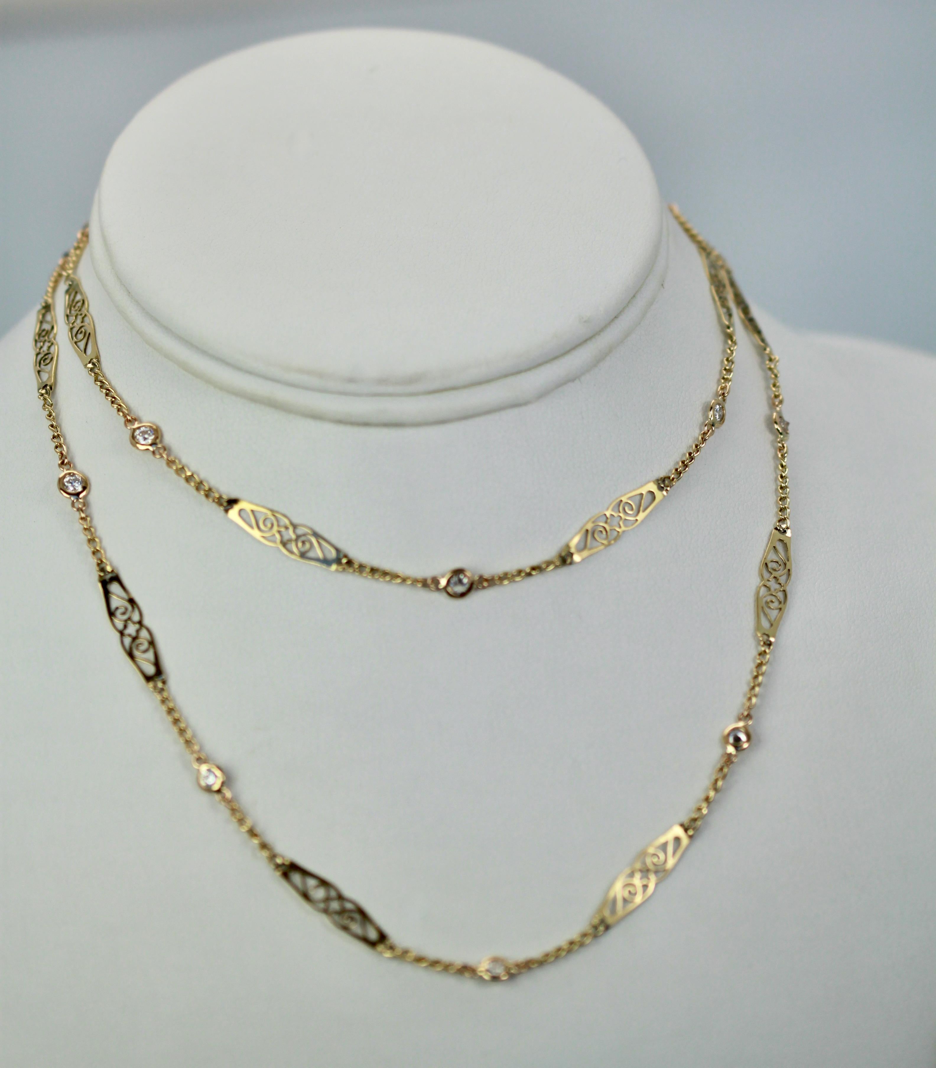 This lovely chain is made from 14K Yellow gold with a beautiful filigree design.  It is studded with Diamonds between each filigree section. Throughout the chain are Diamonds that light up this beautiful chain.  There are 1.16 Carats of G, VS2