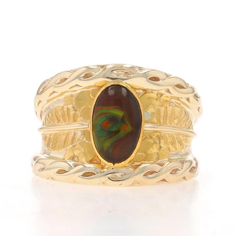 Size: 6 1/4

Metal Content: 14k Yellow Gold & 24k Yellow Gold

Stone Information

Natural Fire Agate
Cut: Oval Cabochon

Style: Solitaire
Theme: Leaves
Features: Textured Detailing

Measurements

Face Height (north to south): 5/8