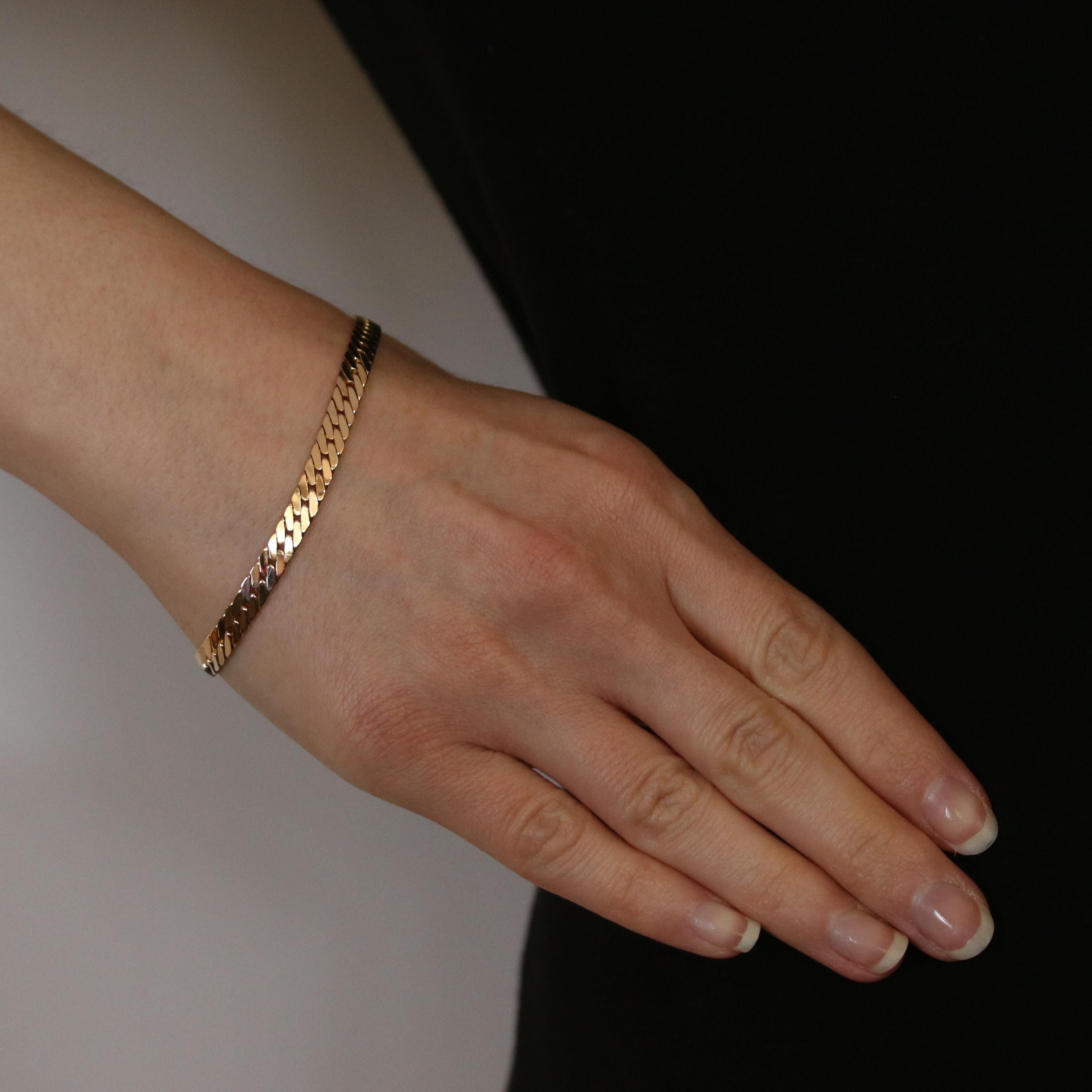 Metal Content: 14k Yellow Gold 

Bracelet Style: Chain 
Chain Style: Flat Curb 
Fastening Type: Tab Box Clasp with Side Safety Clasp

Measurements: 
Length: 7 1/4