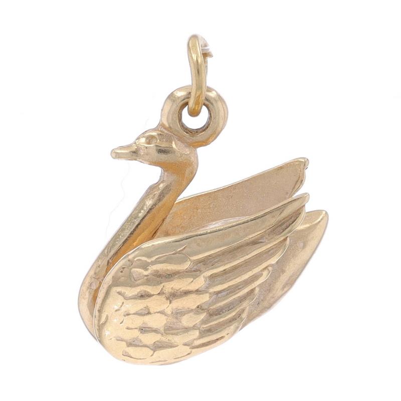 Metal Content: 10k Yellow Gold

Theme: Floating Swan, Graceful Bird

Measurements

Tall (from stationary bail): 21/32