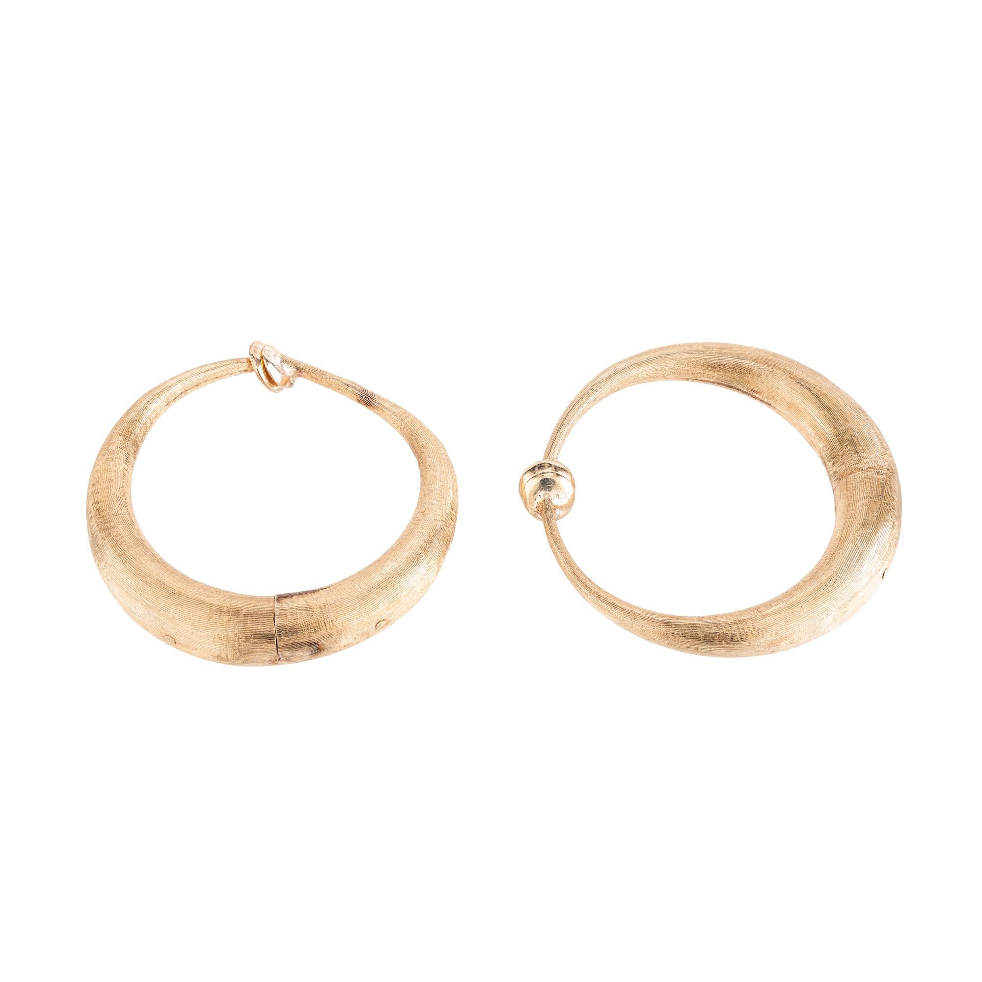 These 1950's 14k yellow gold Florentine crescent non-pierced hoop earrings are the epitome of sophisticated style perfect for anyone to add to their everyday look or dress up for a special event. These earrings are well made with secure pads that