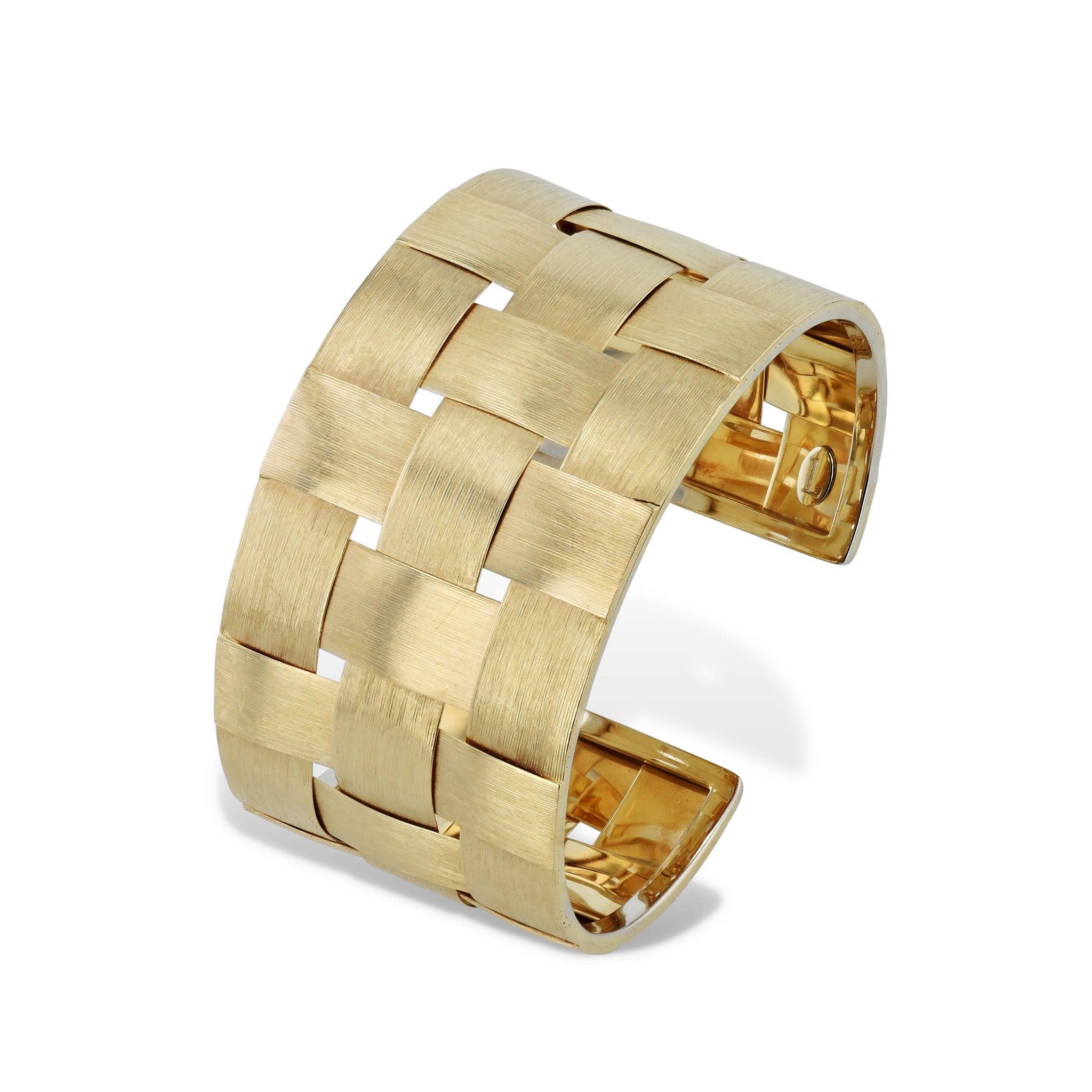 Radiate majesty and class with this 18kt Yellow gold Florentine Weave Estate Cuff Bracelet. Exquisitely crafted to 1.33 inches wide, it's a stunningly beautiful Italian-made accessory that sets you apart from the crowd. Dare to be different with the