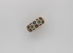 Yellow gold flower pavé ring set with diamonds, sapphire, ruby and peridots
