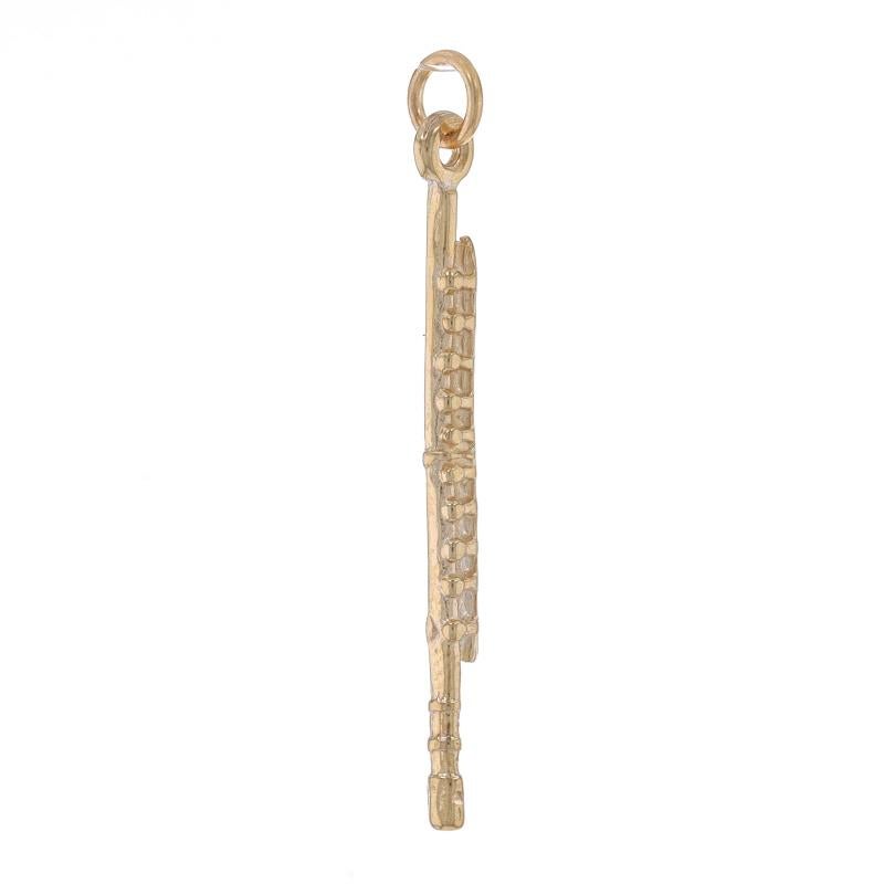 Metal Content: 14k Yellow Gold

Theme: Flute, Woodwind Musical Instrument
Features: Textured Detailing

Measurements

Tall (from stationary bail): 1 7/16