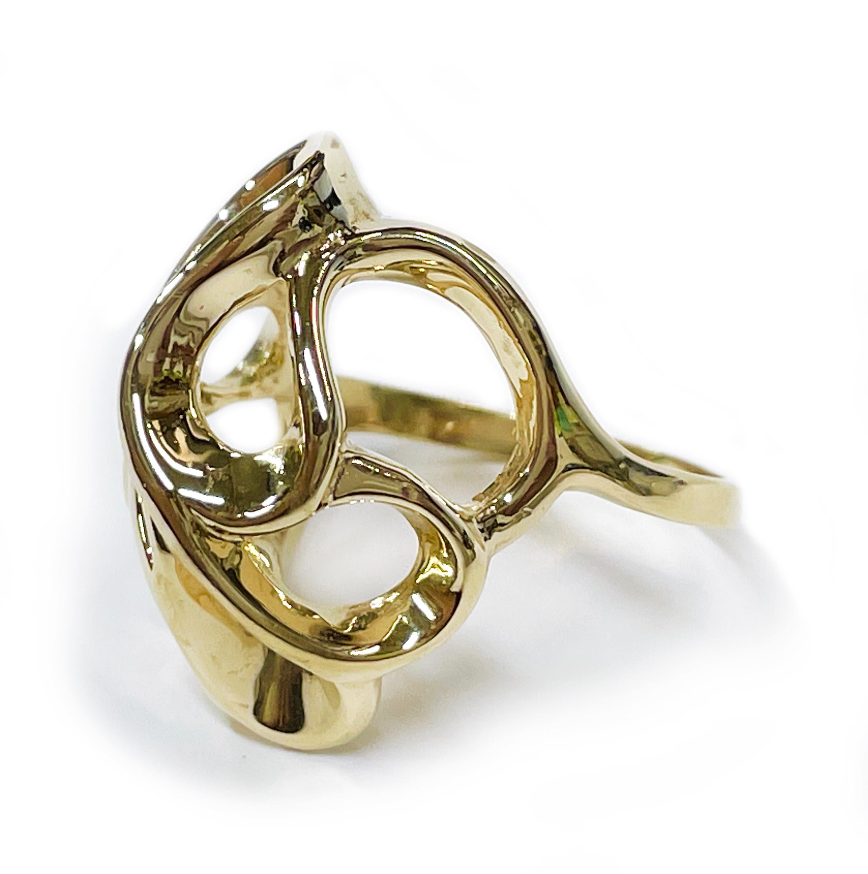 14 Karat Yellow Gold Free Form Ribbon Ring. This ring features ribbons of gold creating free form swirls in a dome shape. Stamped on the inside of the band is 14K. The ring size is 8. The ring has a total weight of 10.1 grams. 