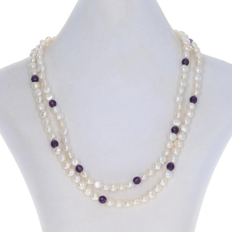 Metal Content: 14k Yellow Gold

Stone Information
Freshwater Pearls
Color: White

Natural Amethysts
Cut: Bead
Color: Purple

Style: Double Strand
Fastening Type: Tab Box Clasp with Safety Bar

Measurements
Length: 16 3/4