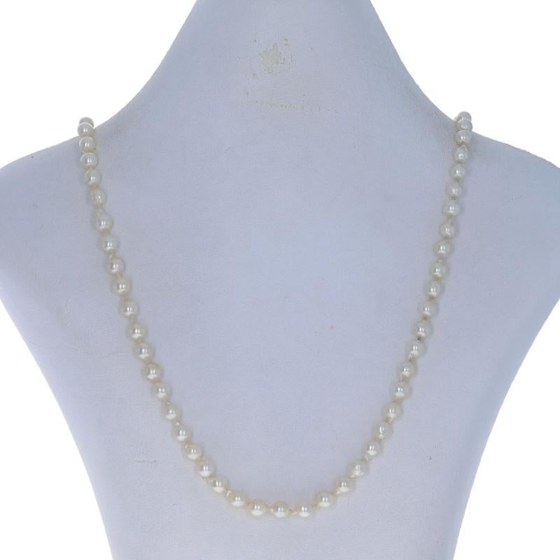 Metal Content: 14k Yellow Gold

Stone Information
Freshwater Pearls
Color: Cream
Size: 5.6mm - 6mm (3.9mm clasp accent)

Style: Knotted Strand
Fastening Type: Fishhook Clasp

Measurements
Length: 24 3/4