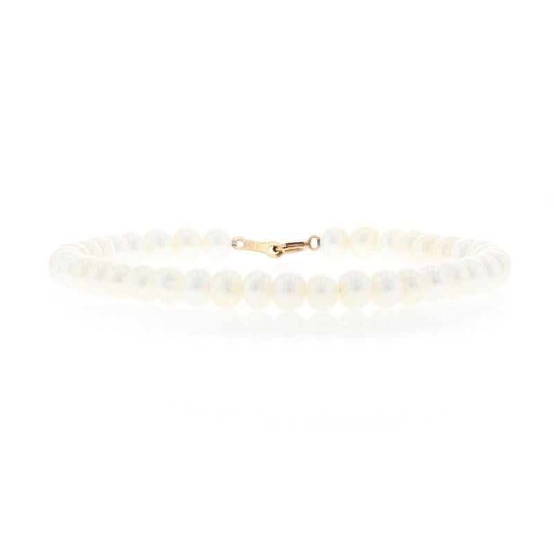 Metal Content: 10k Yellow Gold

Stone Information:
Freshwater Pearls
Color: White 

Bracelet Style: Strand
Closure Type: Spring Ring Clasp 

Measurements
Length 6 3/4